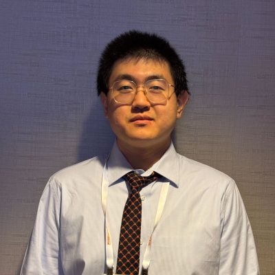 man in dress shirt smiling, profile view